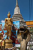 Bangkok Wat Arun - Buddha statue along the four minor chedis inside the temple compound.